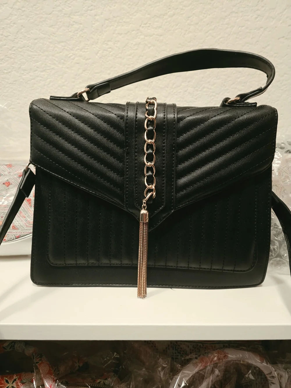 Black Quilted Top-Handle Shoulder Bag with Gold Chain Tassel